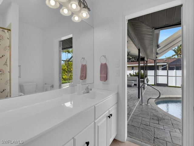 bathroom with toilet and vanity