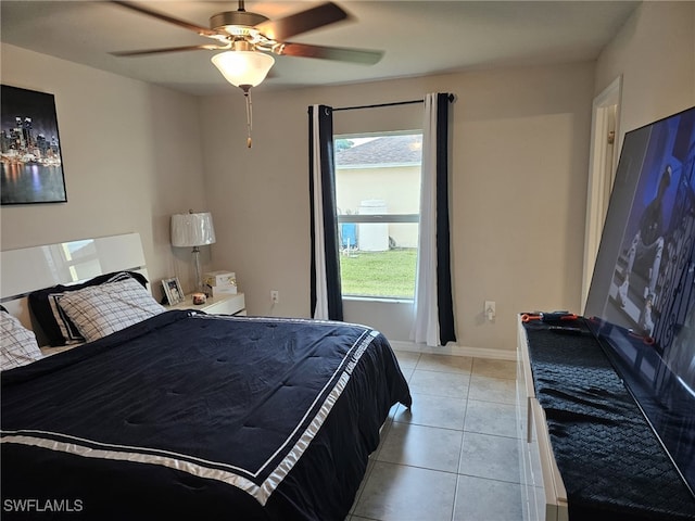 bedroom featuring ceiling fan and light tile patterned floors