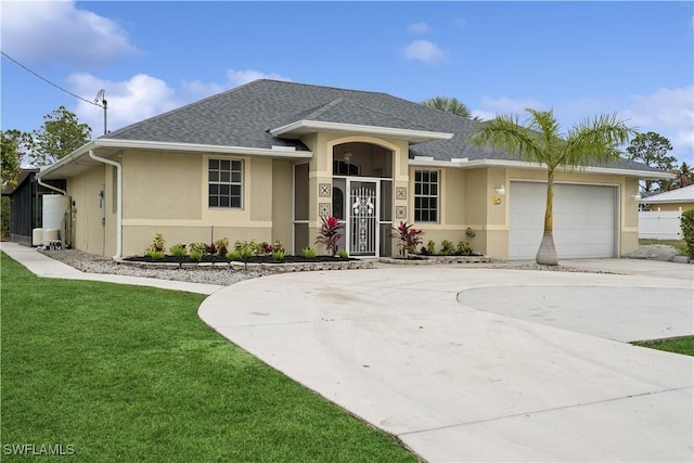 ranch-style home featuring a garage and a front lawn