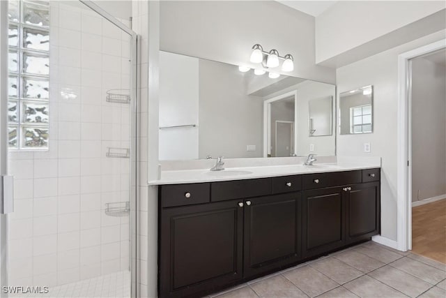 bathroom featuring vanity, an enclosed shower, and tile patterned floors