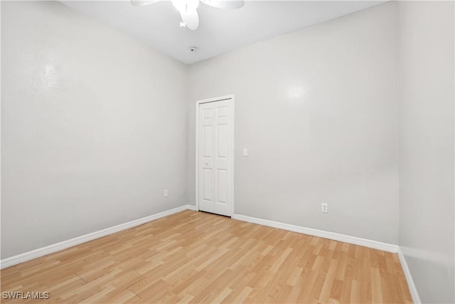 unfurnished room featuring light hardwood / wood-style floors and ceiling fan