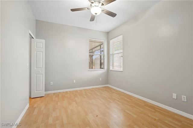 spare room with ceiling fan and light hardwood / wood-style flooring