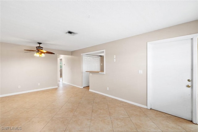 spare room with ceiling fan