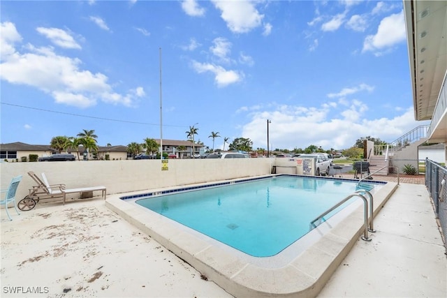 view of pool featuring a patio area