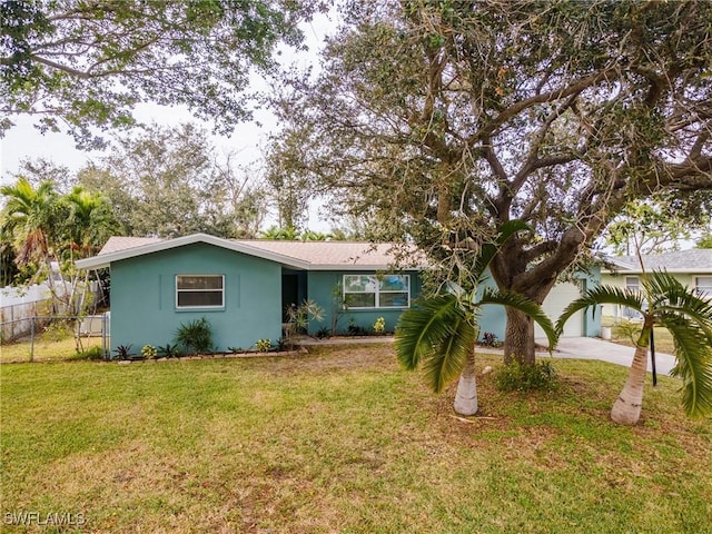 ranch-style home with a front yard and a garage