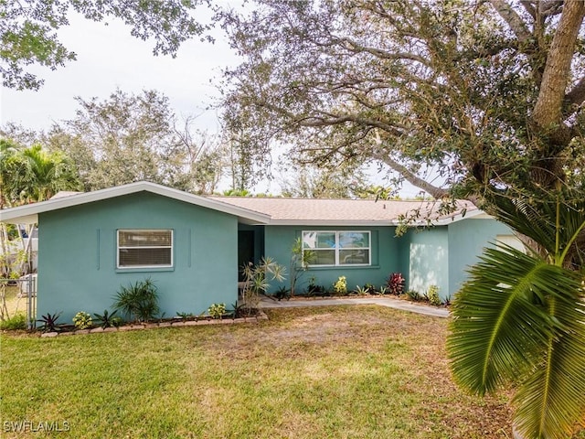 ranch-style house with a front lawn