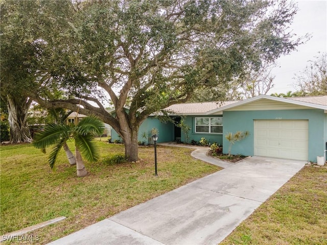 single story home with a garage and a front lawn