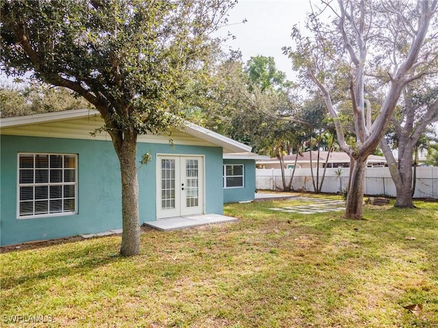 view of yard with french doors