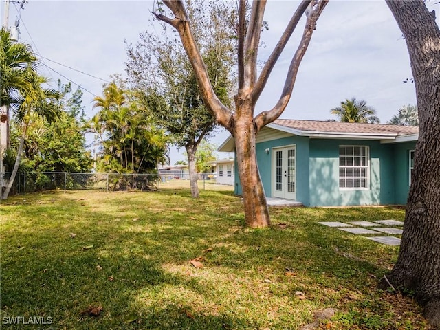 view of yard with french doors