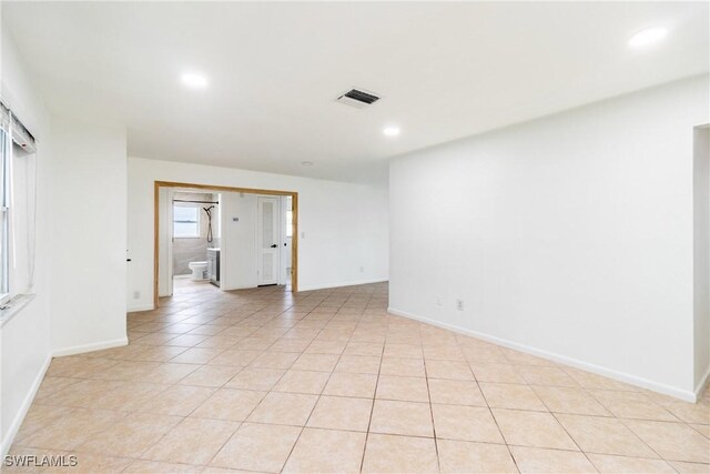 empty room featuring light tile patterned floors