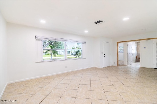 spare room with light tile patterned flooring