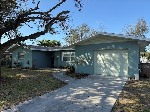 ranch-style home with a garage and a front yard