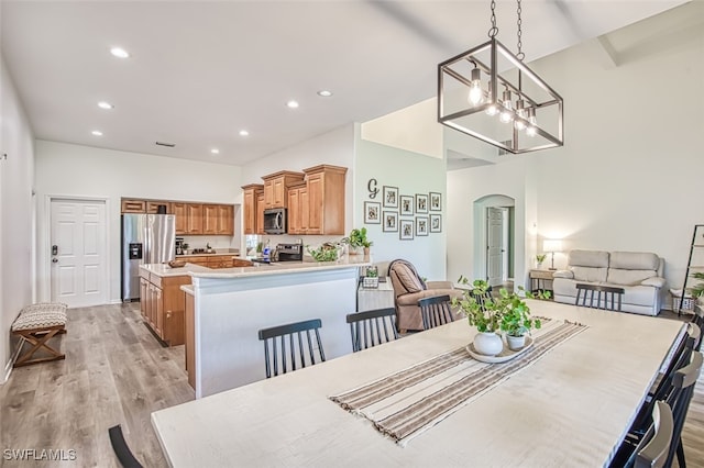 dining space with light hardwood / wood-style flooring