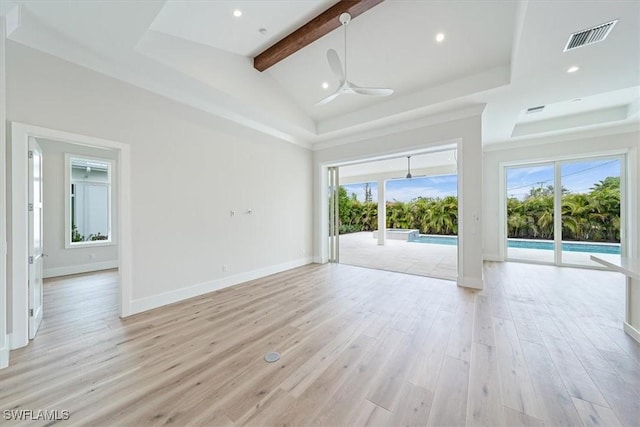 spare room featuring high vaulted ceiling, a wealth of natural light, ceiling fan, and light wood-type flooring