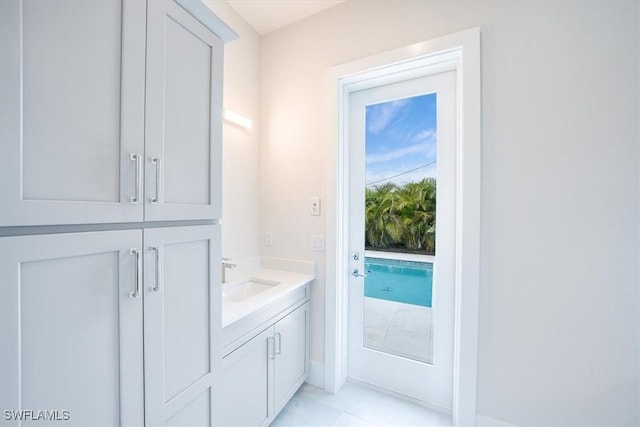 bathroom featuring tile patterned floors and vanity