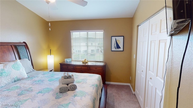 carpeted bedroom featuring a closet and ceiling fan