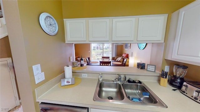 kitchen with sink and white cabinets