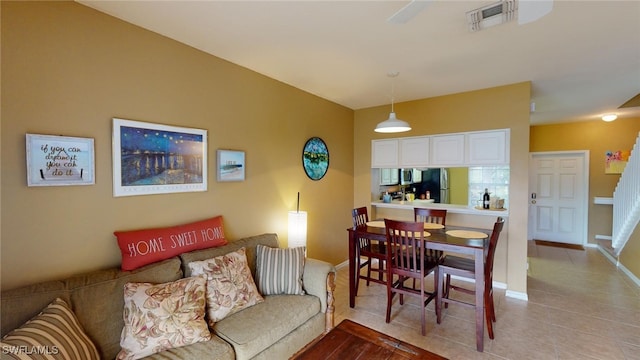 dining area featuring light tile patterned floors