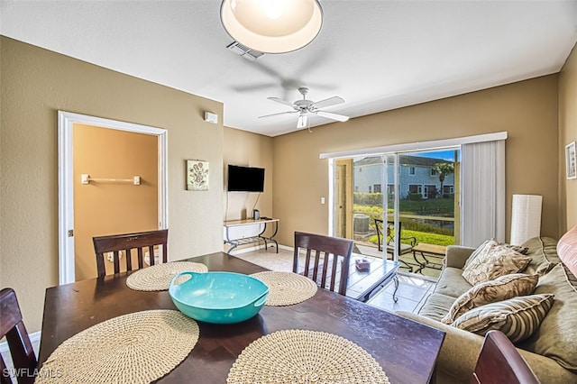 dining area with visible vents, baseboards, and a ceiling fan