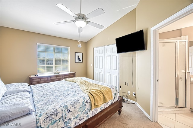 bedroom featuring light carpet, a ceiling fan, baseboards, vaulted ceiling, and a closet