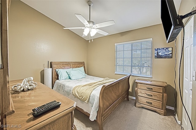 bedroom featuring lofted ceiling, light colored carpet, ceiling fan, and baseboards