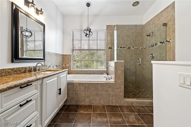 bathroom with vanity, plus walk in shower, tile patterned flooring, and a wealth of natural light