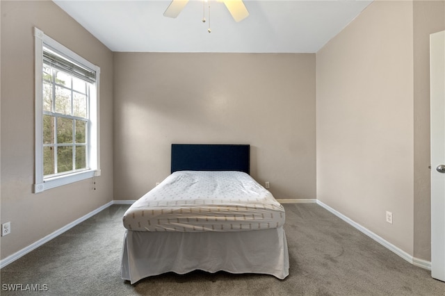 bedroom with ceiling fan and carpet