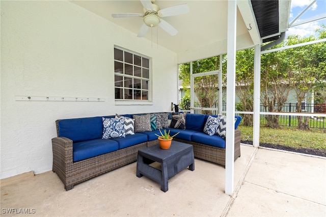 sunroom featuring ceiling fan