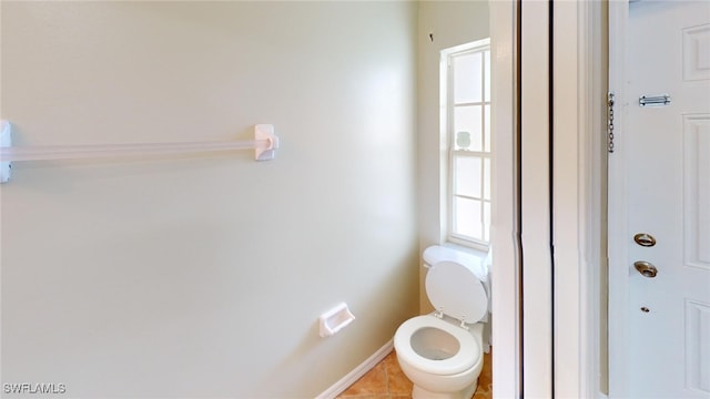 bathroom featuring tile patterned floors and toilet