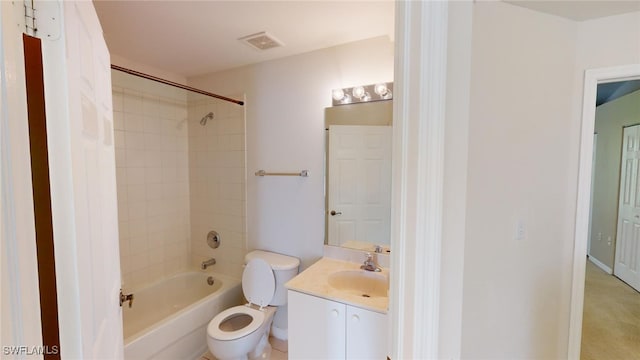 full bathroom with vanity, toilet, and tiled shower / bath combo