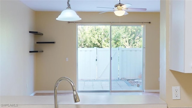 interior space featuring ceiling fan