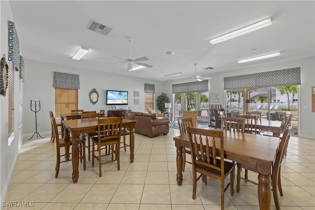 dining room featuring light tile patterned floors and ceiling fan