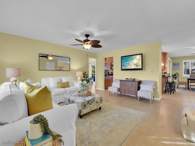 tiled living room with ceiling fan