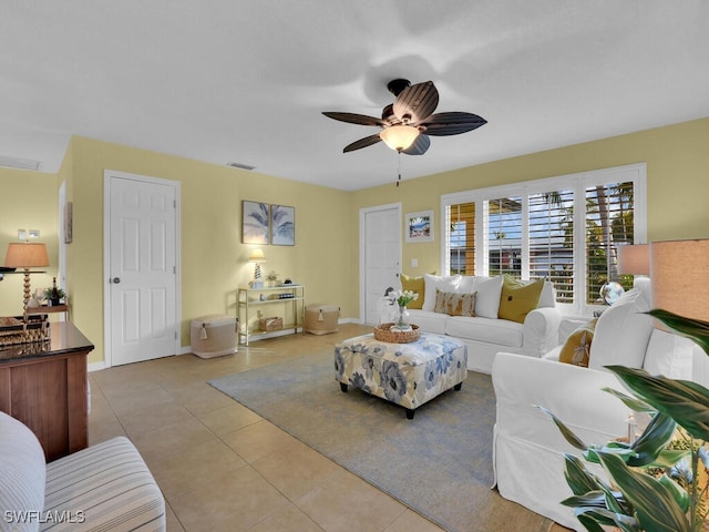 living room with light tile patterned floors and ceiling fan