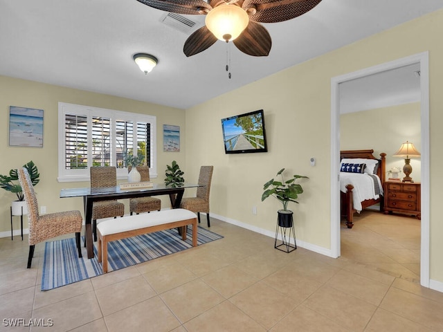 dining area featuring light tile patterned flooring and ceiling fan