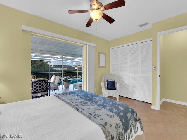 bedroom with ceiling fan, a closet, and tile patterned flooring