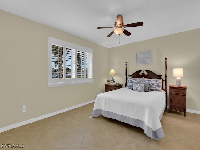 bedroom featuring light tile patterned floors and ceiling fan