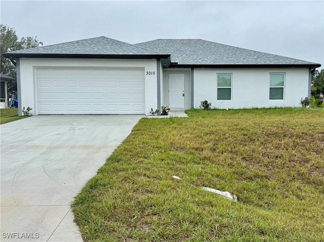 view of front of home featuring a garage and a front lawn