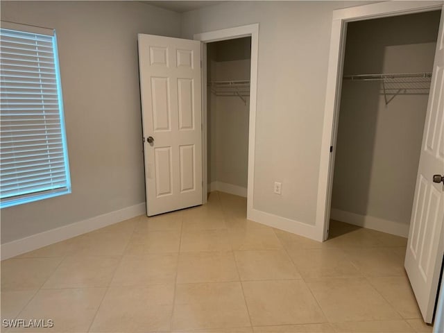 unfurnished bedroom featuring light tile patterned floors