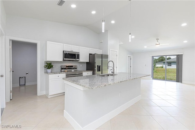 kitchen featuring stainless steel appliances, a kitchen island with sink, and white cabinets