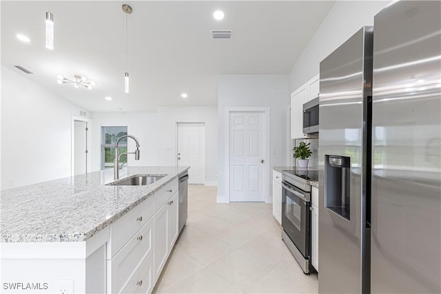 kitchen with stainless steel appliances, decorative light fixtures, sink, and white cabinets