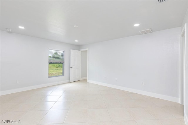 spare room with light tile patterned floors