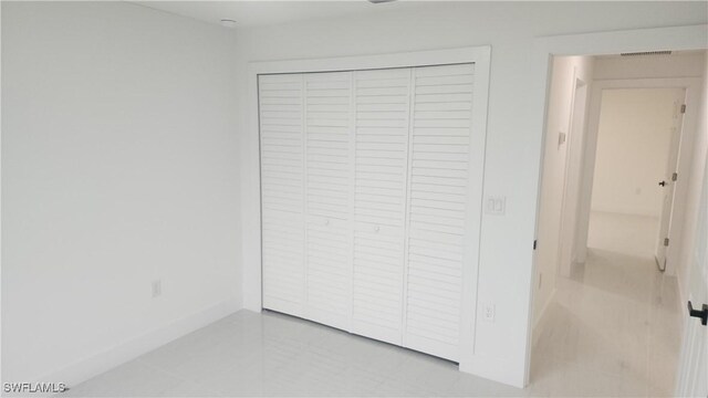 unfurnished bedroom featuring a closet