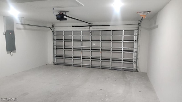 garage with electric panel and a garage door opener