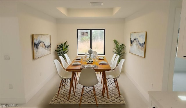 dining room featuring a tray ceiling