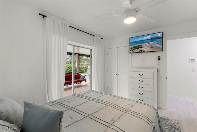 bedroom with a closet, ceiling fan, hardwood / wood-style floors, and access to exterior