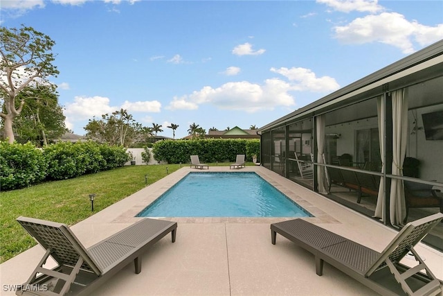 view of swimming pool with a patio area and a lawn