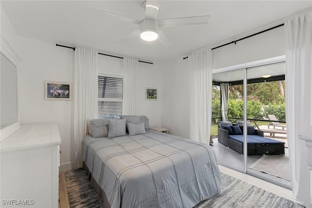 bedroom featuring ceiling fan, access to exterior, wood-type flooring, and a closet