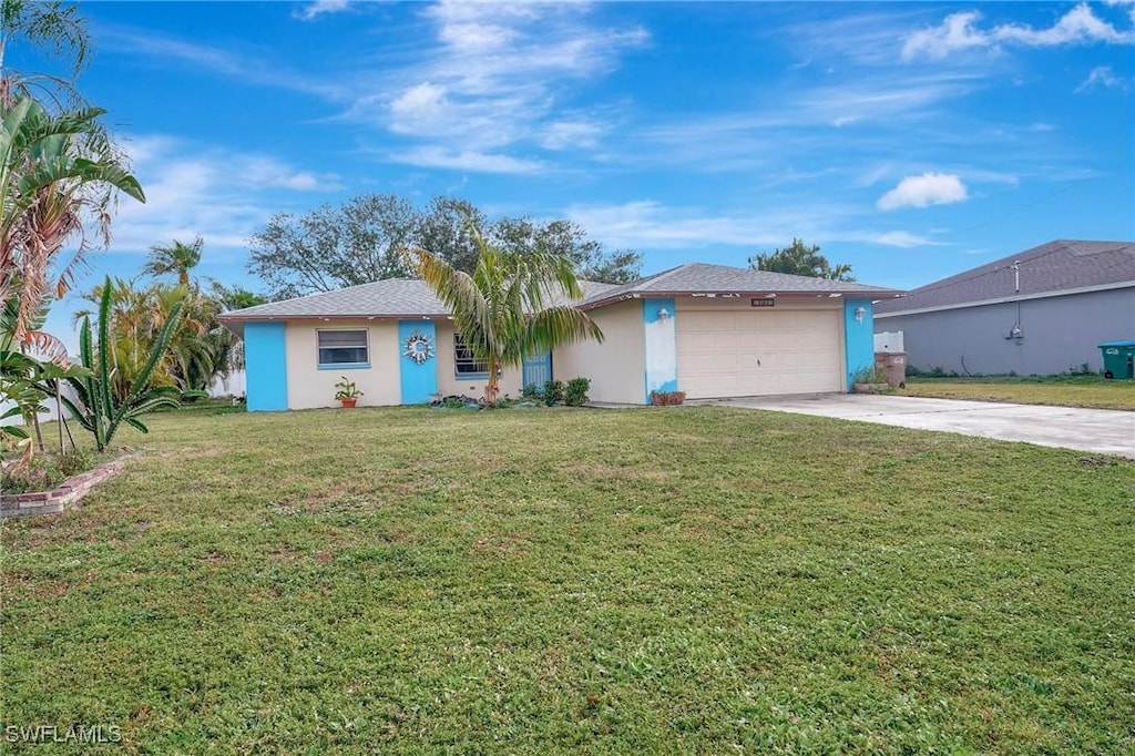 ranch-style house featuring a front lawn and a garage