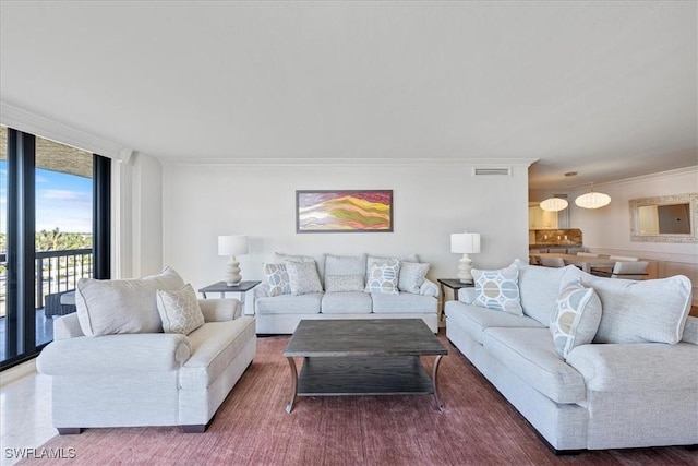 living room featuring floor to ceiling windows and ornamental molding